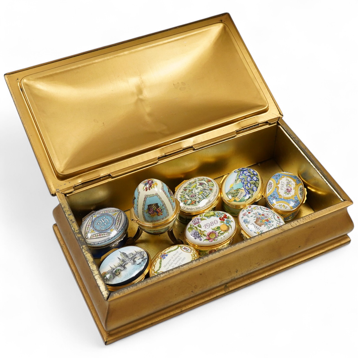 Eight Halcyon days enamel year boxes and an enamel egg shaped box on stand (9)